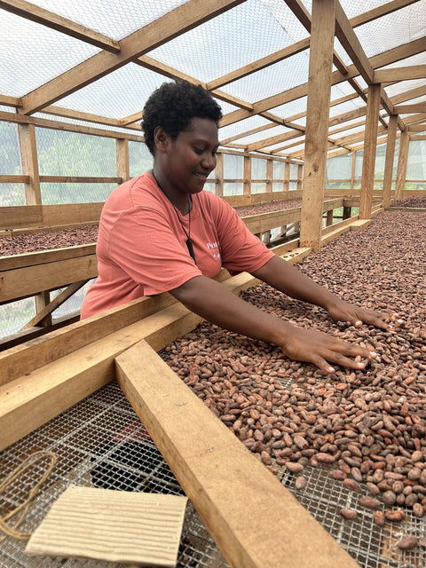 Agnes Pilapaso drying cocoa