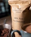 Pure 100% Hot Chocolate 150g Packet with hot chocolate in a mug
