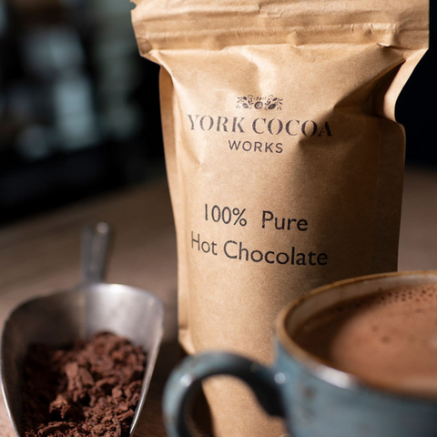 Pure 100% Hot Chocolate 150g Packet with hot chocolate in a mug