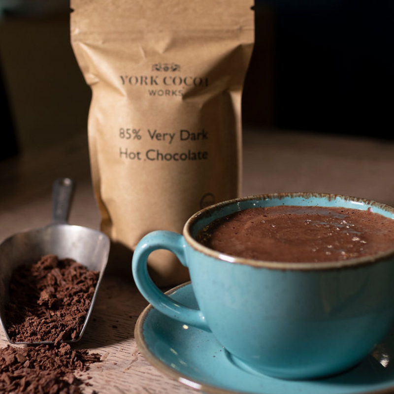 85% Very Dark Hot Chocolate 150g Packet and full mug of hot chocolate 